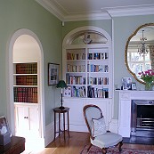 Family room with classic white painted shelving