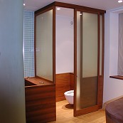 Teak and glass toilet cubicle